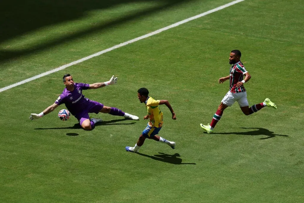 MIAMI GARDENS, FLORIDA – JUNE 25: Tashreeq Matthews #17 of Mamelodi Sundowns FC attempts a shot on goal while under pressure from Fabio #1 of Fluminense FC during the FIFA Club World Cup 2025 group F match between Mamelodi Sundowns FC and Fluminense FC at Hard Rock Stadium on June 25, 2025 in Miami Gardens, Florida. (Photo by Dan Mullan/Getty Images)