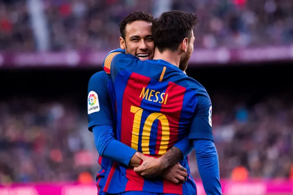 Lionel Messi of FC Barcelona celebrates with his teammate Neymar Santos Jr. Alex Caparros/Getty Images