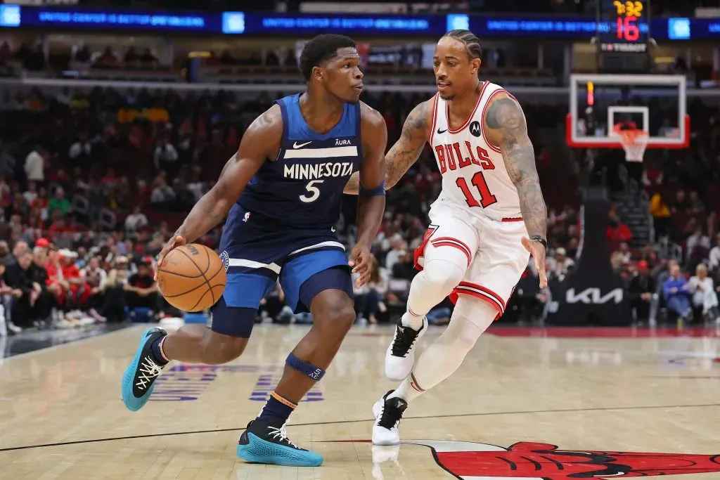 Anthony Edwards #5 of the Minnesota Timberwolves drives to the basket against DeMar DeRozan #11 of the Chicago Bulls. Michael Reaves/Getty Images