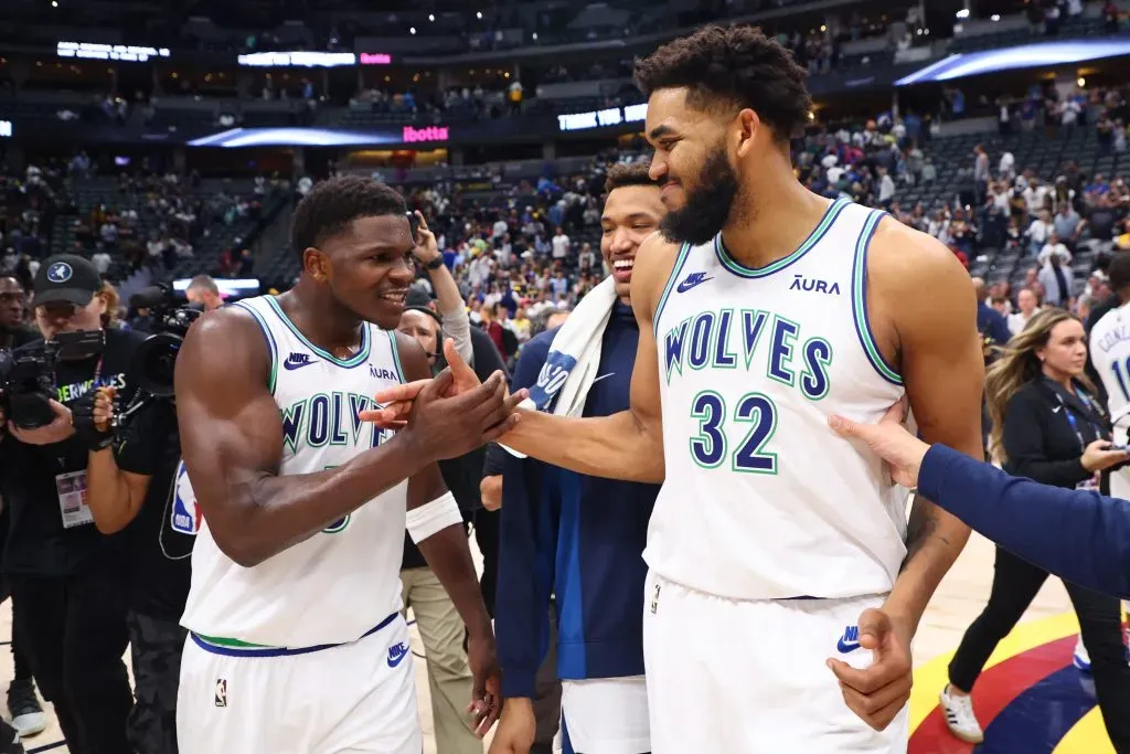 Anthony Edwards #5 and Karl-Anthony Towns #32 of the Minnesota Timberwolves celebrate after winning Game Seven of the Western Conference against the Denver Nuggets. C. Morgan Engel/Getty Images