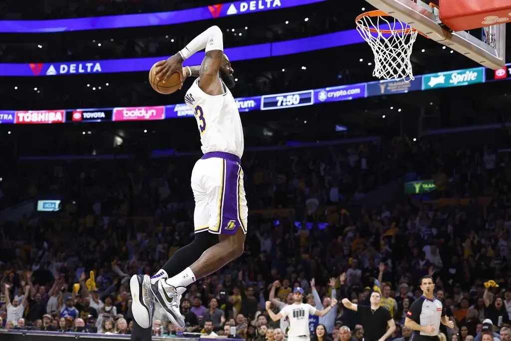 LeBron James #23 of the Los Angeles Lakers makes the slam dunk against the Denver Nuggets. Ronald Martinez/Getty Images