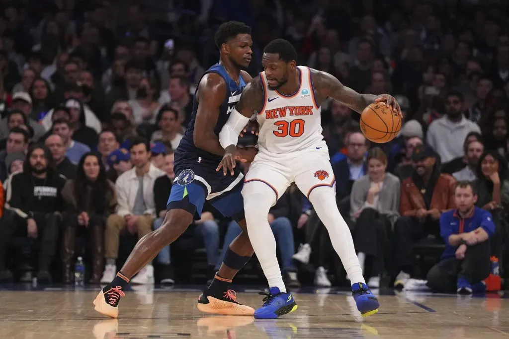 Julius Randle #30 of the New York Knicks dribbles the ball against Anthony Edwards #5 of the Minnesota Timberwolves. Mitchell Leff/Getty Images