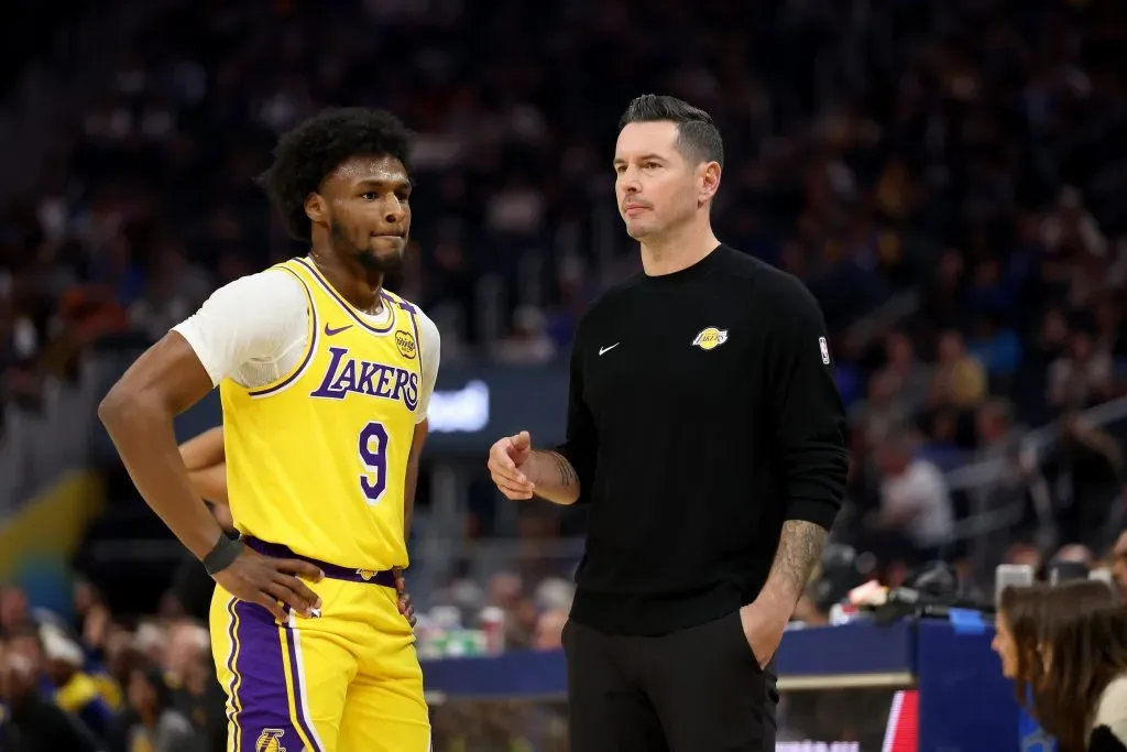 Los Angeles Lakers head coach JJ Redick talks to Bronny James #9 during the first half of their preseason game against the Golden State Warriors. Ezra Shaw/Getty Images