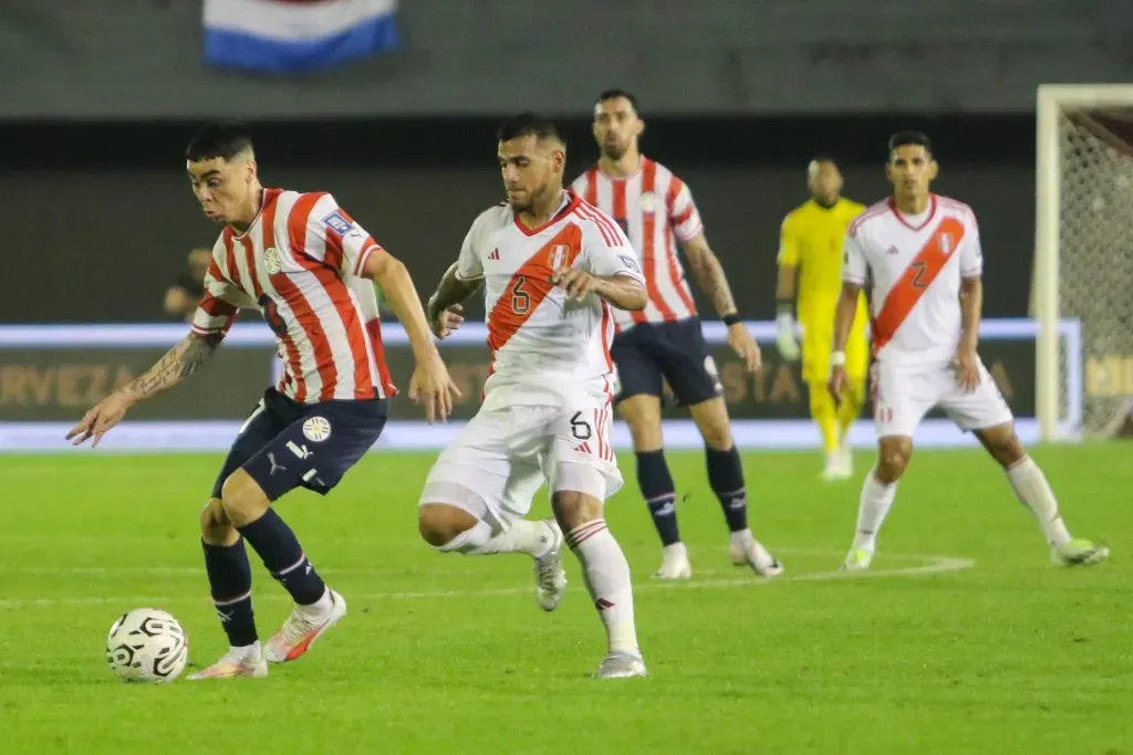 CIUDAD DEL ESTE, PARAGUAY – SEPTEMBER 07: Miguel Almiron of Paraguay battles for possession with Miguel Trauco of Peru during a FIFA World Cup 2026 Qualifier match between Paraguay and Peru at Antonio Aranda Stadium on September 07, 2023 in Ciudad del Este, Paraguay. (Photo by Christian Alvarenga/Getty Images)