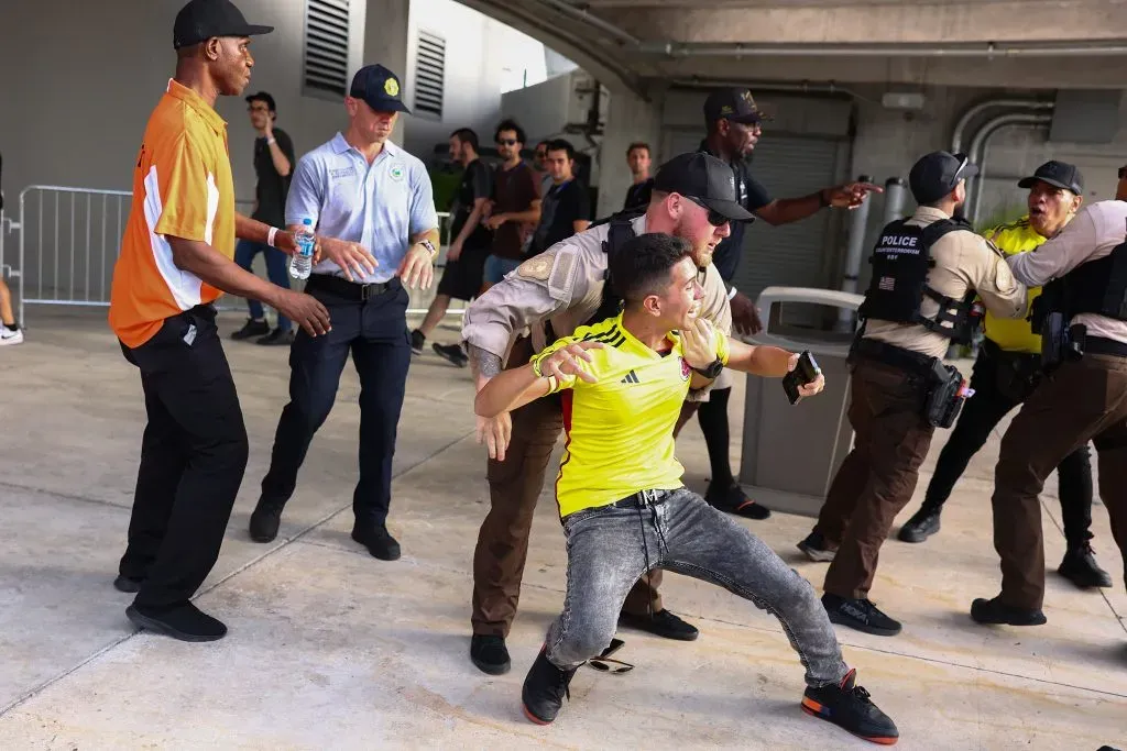 MIAMI GARDENS, FLORIDA – JULY 14: Police officers try to arrest a Colombian fan outside the stadium the CONMEBOL Copa America 2024 Final match between Argentina and Colombia at Hard Rock Stadium on July 14, 2024 in Miami Gardens, Florida. (Photo by Maddie Meyer/Getty Images)