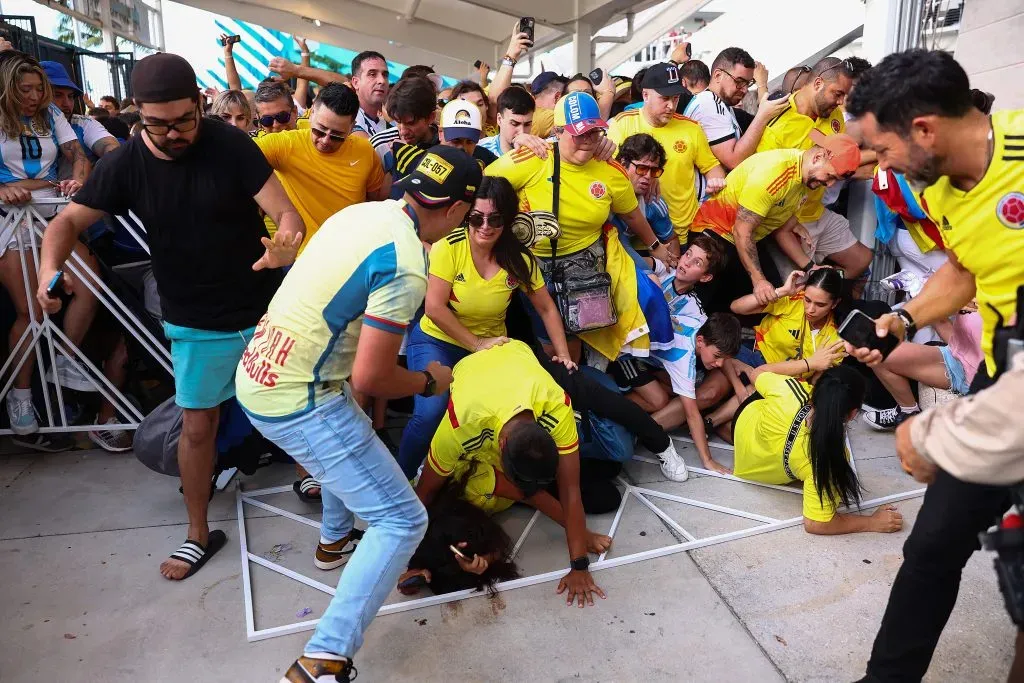 MIAMI GARDENS, FLORIDA – JULY 14: Fans of Colombia and Argentina try to pass the gate amid disturbances the CONMEBOL Copa America 2024 Final match between Argentina and Colombia at Hard Rock Stadium on July 14, 2024 in Miami Gardens, Florida. (Photo by Maddie Meyer/Getty Images)