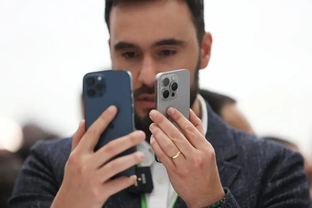 CUPERTINO, CALIFORNIA – SEPTEMBER 12:  An attendee looks at the brand new Apple iPhone 15 Pro and iPhone 15 Pro Max products during an Apple event on September 12, 2023 in Cupertino, California. Apple revealed its lineup of the latest iPhone 15 versions as well as other product upgrades during the event. (Photo by Justin Sullivan/Getty Images)