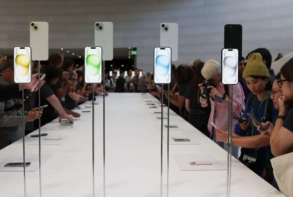 CUPERTINO, CALIFORNIA – SEPTEMBER 12:  Attendees look at brand new Apple products during an Apple event at the Steve Jobs Theater at Apple Park on September 12, 2023 in Cupertino, California. Apple revealed its lineup of the latest iPhone 15 versions as well as other product upgrades during the event. (Photo by Justin Sullivan/Getty Images)