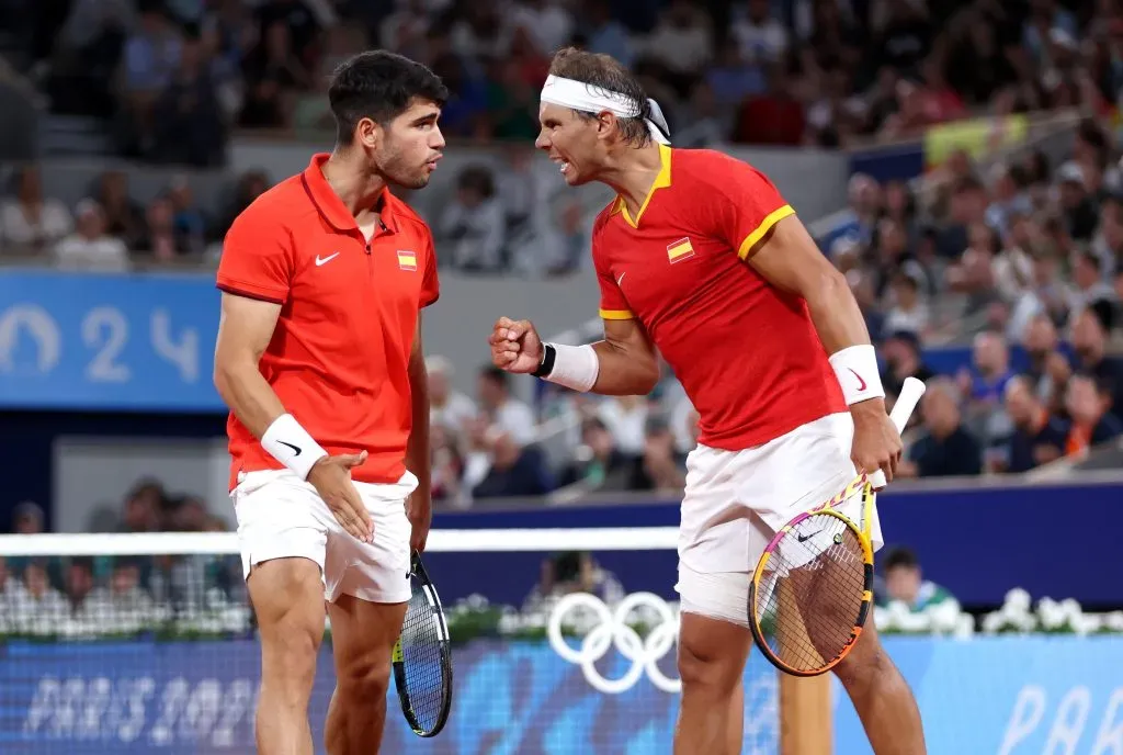 PARIS, FRANCE – JULY 27: Rafael Nadal (R) and partner Carlos Alcaraz of Team Spain celebrate against Andres Molteni and Maximo Gonzalez of Team Argentina during the Men’s Doubles first round match on day one of the Olympic Games Paris 2024 at Roland Garros on July 27, 2024 in Paris, France. (Photo by Clive Brunskill/Getty Images)