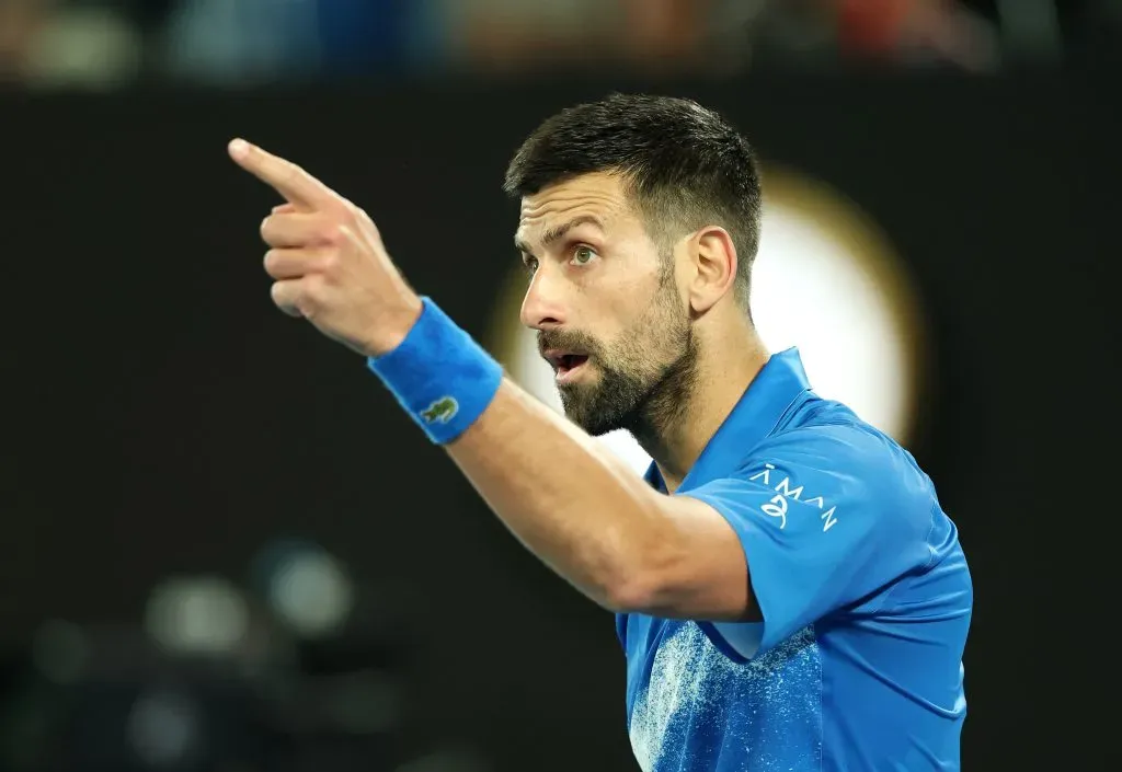 MELBOURNE, AUSTRALIA – JANUARY 17: Novak Djokovic of Serbia points as he celebrates winning match point against Tomas Machac of the Czech Republic in the Men’s Singles Third Round match during day six of the 2025 Australian Open at Melbourne Park on January 17, 2025 in Melbourne, Australia. (Photo by Cameron Spencer/Getty Images)