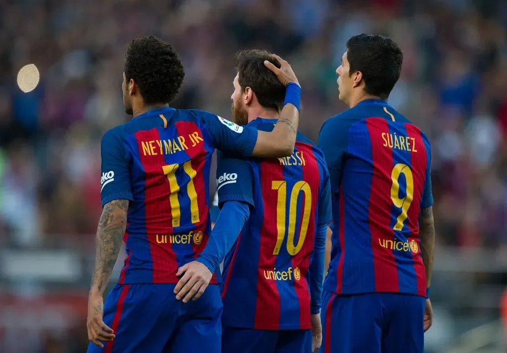 Lionel Messi of FC Barcelona celebrates with Neymar and Luis Suarez no Barcelona (Photo by Denis Doyle/Getty Images)
