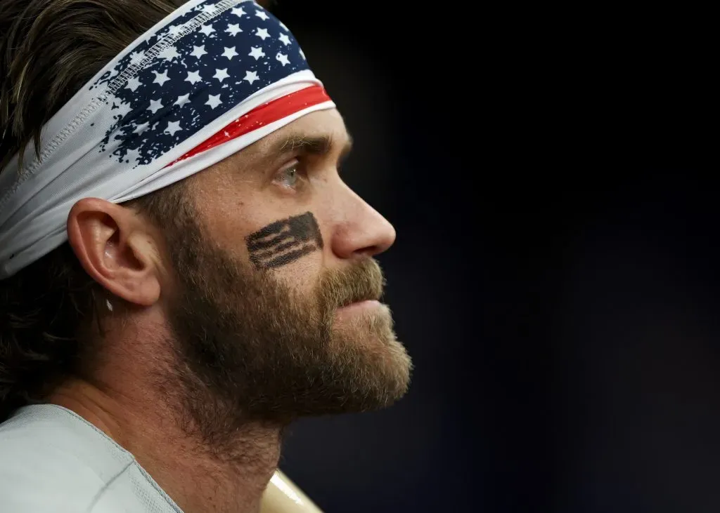 ST PETERSBURG, FL – JULY 4: Bryce Harper #3 of the Philadelphia Phillies looks on from the dugout while wearing Fourth of July face paint during the first inning against the Tampa Bay Rays at Tropicana Field on July 4, 2023 in St Petersburg, Florida. (Photo by Kevin Sabitus/Getty Images)