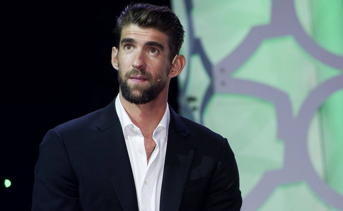 Why is Michael Phelps not competing within the Paris Olympics?