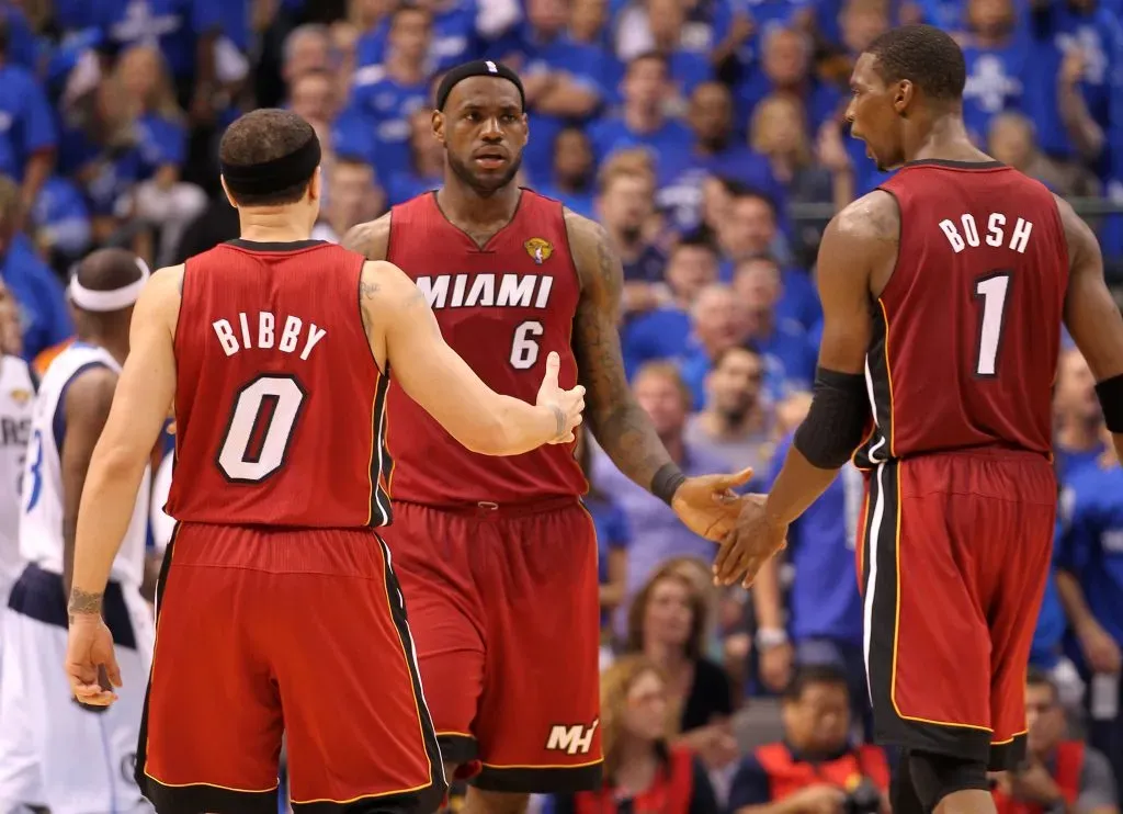 Mike Bibby, LeBron James #6 and Chris Bosh #1 of the Miami Heat stand on court against the Dallas Mavericks. Mike Ehrmann/Getty Images