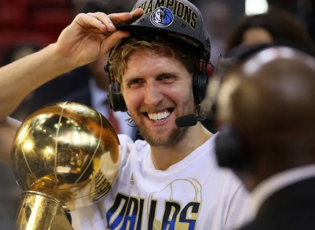 Dirk Nowitzki of the Dallas Mavericks holds the championship trophy after defeating the Miami Heat .IMAGO / ZUMA Press Wire