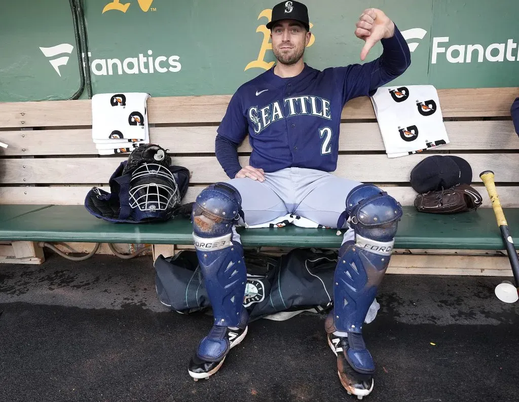 OAKLAND, CALIFORNIA – MAY 03: Catcher Tom Murphy #2 of the Seattle Mariners gives a thumbs down to a rain delay prior to playing the Oakland Athletics at RingCentral Coliseum on May 03, 2023 in Oakland, California. (Photo by Thearon W. Henderson/Getty Images)