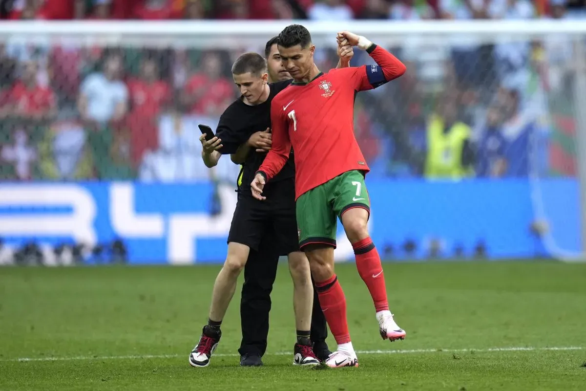 The match was disrupted on numerous occasions near the end as multiple pitch invaders ran onto the field of play