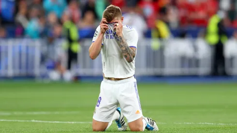 PARIS, FRANCE – MAY 28: Toni Kroos of Real Madrid drops to his knees as he celebrates winning the UEFA Champions League final match between Liverpool FC and Real Madrid at Stade de France on May 28, 2022 in Paris, France. (Photo by Catherine Ivill/Getty Images)