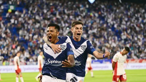 Damián Fernández of Velez Sarsfield celebrates with teammate Valentín Gómez after scoring the team's second goal during the Liga Profesional 2024 match between Velez Sarsfield and Huracan at Jose Amalfitani Stadium on December 15, 2024 in Buenos Aires, Argentina.