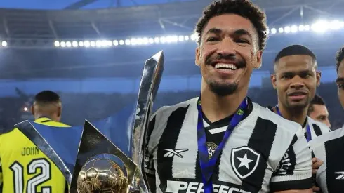 RIO DE JANEIRO, BRAZIL – DECEMBER 08: Adryelson of Botafogo poses with the champions trophy after a match between Botafogo and Sao Paulo as part of Brasileirao 2024 at Estadio Olímpico Nilton Santos on December 08, 2024 in Rio de Janeiro, Brazil. (Photo by Buda Mendes/Getty Images)