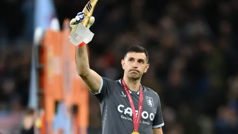BIRMINGHAM, ENGLAND - JANUARY 04: Emiliano Martinez of Aston Villa holds his adidas FIFA World Cup Golden Glove trophy while wearing his FIFA World Cup winners medal prior to the Premier League match between Aston Villa and Wolverhampton Wanderers at Villa Park on January 04, 2023 in Birmingham, England. (Photo by Dan Mullan/Getty Images)