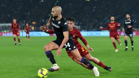 ROME, ITALY - JANUARY 15: Sofyan Amrabat of ACF Fiorentina is challenged by Paulo Dybala of AS Roma during the Serie A match between AS Roma and ACF Fiorentina at Stadio Olimpico on January 15, 2023 in Rome, Italy. (Photo by Paolo Bruno/Getty Images)