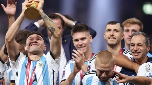 LUSAIL CITY, QATAR – DECEMBER 18: Gonzalo Montiel of Argentina lifts the FIFA World Cup Qatar 2022 Winner's Trophy during the FIFA World Cup Qatar 2022 Final match between Argentina and France at Lusail Stadium on December 18, 2022 in Lusail City, Qatar. (Photo by Julian Finney/Getty Images)