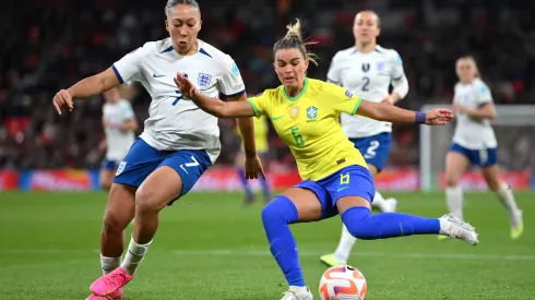 LONDON, ENGLAND – APRIL 06: Tamires of Brazil passes the ball whilst under pressure from Lauren James of England during the Women´s Finalissima 2023 match between England and Brazil at Wembley Stadium on April 06, 2023 in London, England. (Photo by Justin Setterfield/Getty Images)