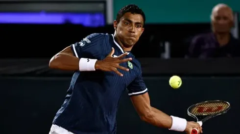 RIO DE JANEIRO, BRAZIL - MARCH 05: Thiago Monteiro of Brazil returns a shot against Jan-Lennard Struff of Germany during their singles match on Day One of the 2022 Davis Cup Qualifier at Parque Olímpico Arena Tenis on March 04, 2022 in Rio de Janeiro, Brazil. (Photo by Buda Mendes/Getty Images)