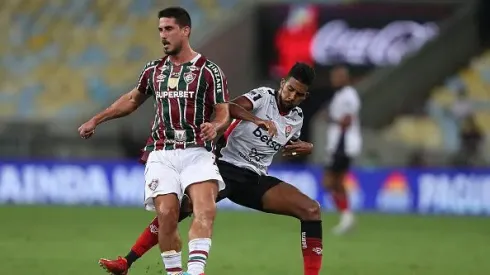 RIO DE JANEIRO, BRAZIL - JUNE 27: Gabriel Pires of Fluminense fights for the ball with Willian Oliveira of Vitoria during the match between Fluminense and Vitoria as part of Brasileirao 2024 at Maracana Stadium on June 27, 2024 in Rio de Janeiro, Brazil.