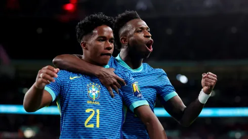 LONDON, ENGLAND – MARCH 23: Endrick of Brazil celebrates scoring his team's first goal with teammate Vinicius Junior during the international friendly match between England and Brazil at Wembley Stadium on March 23, 2024 in London, England. (Photo by Catherine Ivill/Getty Images)