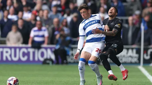 LONDON, ENGLAND – APRIL 21: Reggie Cannon of Queens Park Rangers fouls Ronald of Swansea City during the Sky Bet Championship match between Queens Park Rangers FC and Swansea City AFC at Loftus Road on April 21, 2025 in London, England. (Photo by Warren Little/Getty Images)