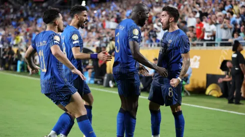 ORLANDO, FLORIDA – JUNE 30: Kalidou Koulibaly #3 of Al Hilal celebrates scoring his team's third goal with Ruben Neves #8 during the FIFA Club World Cup 2025 round of 16 match between Manchester City and Al-Hilal at Camping World Stadium on June 30, 2025 in Orlando, Florida. (Photo by Francois Nel/Getty Images)