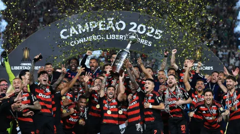 LIMA, PERU – NOVEMBER 29: Giorgian de Arrascaeta and Bruno Henrique of Flamengo lift the Champion's trophy after winning the the 2025 Copa CONMEBOL Libertadores Final match between Palmeiras and Flamengo at Estadio Monumental on November 29, 2025 in Lima, Peru. (Photo by Buda Mendes/Getty Images)