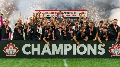 VANCOUVER, CANADA – JUNE 7: Ryan Raposo #27 of the Vancouver Whitecaps FC hoists the cup as the team celebrates their victory over CF Montreal during the Canadian Championship game at BC Place on June 7, 2023 in Vancouver, Canada. (Photo by Christopher Morris – Corbis/Getty Images)
