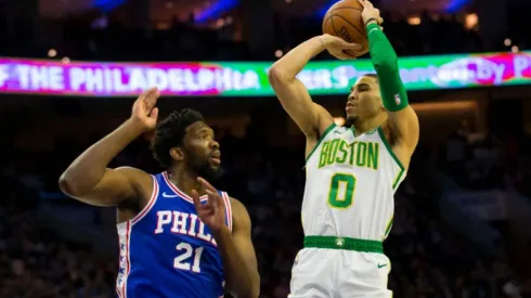 Jayton Tatum shoots over Joel Embiid. (Getty)