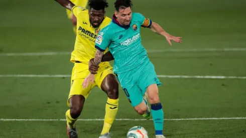 Villarreal's Andre-Frank Zambo Anguissa (left) and FC Barcelona's forward Lionel Messi (right). (Getty)