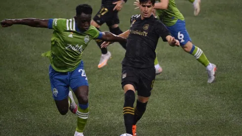 Seattle Sounders defender Yeimar Gomez (left) defends against Los Angeles FC midfielder Francisco Ginella (right). (Getty)