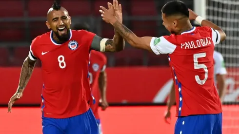 Arturo Vidal of Chile celebrates with teammate Paulo Díaz after scoring against Peru (Getty).