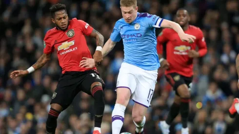 Fred of Manchester United (left) battles with Kevin de Bruyne of Manchester City (right). (Getty)