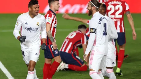 Casemiro (left) of Real Madrid celebrates with teammates after scoring against Atlético de Madrid (Getty).