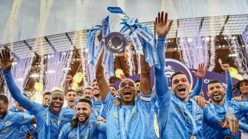 Manchester City players lift the 2020-21 Premier League Trophy. (Getty)