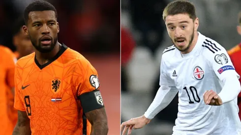 Georginio Wijnaldum of Netherlands (left) and Otar Kiteishvili of Georgia (right). (Getty)