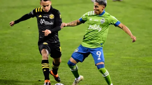 Lucas Zelarrayan of Columbus Crew (left) fights for the ball with Raul Ruidiaz of Seattle Sounders (Getty).