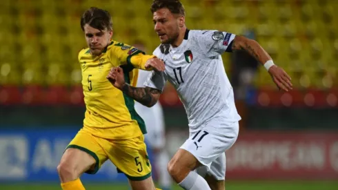 Markas Beneta of Lithuania (left) fights for ball control against Ciro Immobile of Italy (right) (Getty)