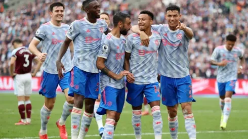 Jesse Lingard of Manchester United celebrates with Aaron Wan-Bissaka, Bruno Fernandes and Cristiano Ronaldo after scoring their team's second goal during the Premier League match between West Ham United and Manchester United at London Stadium on September 19, 2021 in London, England.