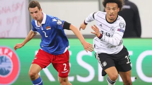 Rafael Grunenfelder of Liechtenstein (left) tries to stop Leroy Sane of Germany