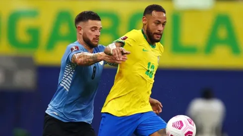 Neymar Jr. of Brazil fights for the ball with Nahitan Nandez of Uruguay