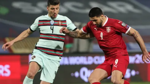 Ruben Dias of Portugal (left) and Aleksandar Mitrovic of Serbia (right)