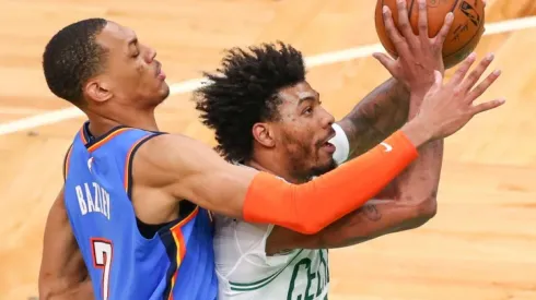 Darius Bazley of Oklahoma City Thunder (left) tries to block a shot of Marcus Smart of Boston Celtics